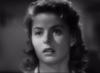 Movie still from “Spellbound” (1945), directed by Alfred Hitchcock – A black - and - white photo of a woman's face; Close Up shot, Over the shoulder angle