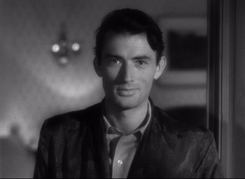 Movie still from “Spellbound” (1945), directed by Alfred Hitchcock – Black and white photograph of a man wearing a suit; Close Up shot, High angle