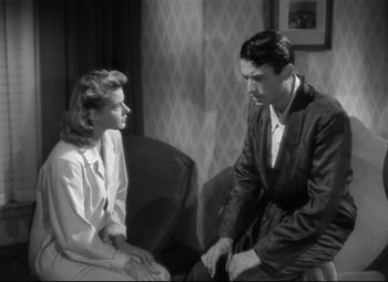 Movie still from “Spellbound” (1945), directed by Alfred Hitchcock – A man and a woman sitting on a couch; Medium shot, High angle