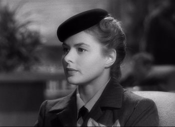 Movie still from “Spellbound” (1945), directed by Alfred Hitchcock – A black and white photo of a woman wearing a hat; Close Up shot, Over the shoulder angle