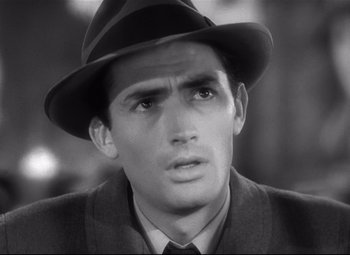 Movie still from “Spellbound” (1945), directed by Alfred Hitchcock – Black and white photograph of a man wearing a hat; Close Up shot, High angle