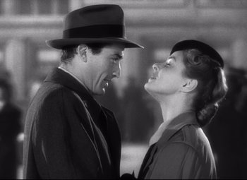 Movie still from “Spellbound” (1945), directed by Alfred Hitchcock – A man and a woman standing next to each other; Close Up shot, Low angle