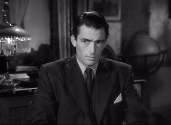 Movie still from “Spellbound” (1945), directed by Alfred Hitchcock – Black and white photograph of a man wearing a suit; Close Up shot, High angle