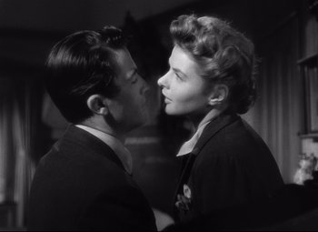 Movie still from “Spellbound” (1945), directed by Alfred Hitchcock – A man and a woman are kissing in a room; Close Up shot, Low angle