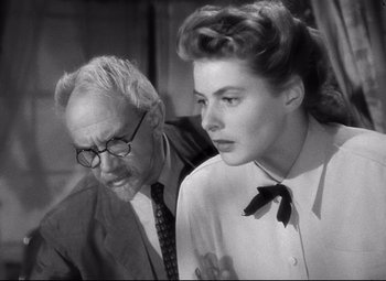 Movie still from “Spellbound” (1945), directed by Alfred Hitchcock – An older man and a young woman looking at each other; Close Up shot, Low angle