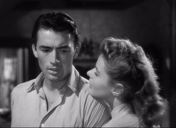 Movie still from “Spellbound” (1945), directed by Alfred Hitchcock – A man and a woman standing next to each other; Close Up shot, Low angle