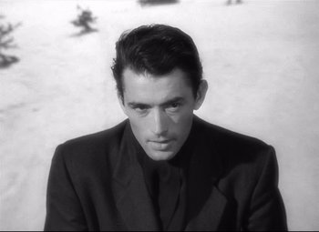 Movie still from “Spellbound” (1945), directed by Alfred Hitchcock – Black and white photograph of a man wearing a suit; Close Up shot, Over the shoulder angle