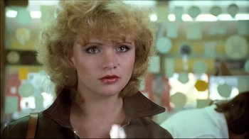 Movie still from “Spetters” (1980), directed by Paul Verhoeven – A person wearing a brown jacket; Close Up shot, Over the shoulder angle