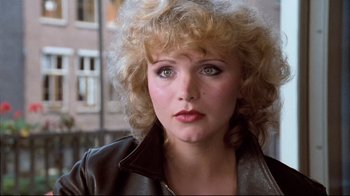 Movie still from “Spetters” (1980), directed by Paul Verhoeven – A person wearing a leather jacket; Close Up shot, Over the shoulder angle