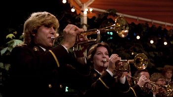 Movie still from “Spetters” (1980), directed by Paul Verhoeven – A man and a woman playing their instruments; Medium shot, Low angle