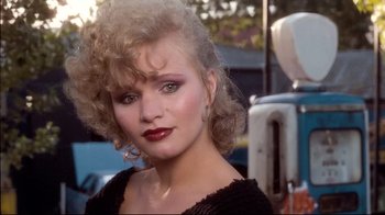 Movie still from “Spetters” (1980), directed by Paul Verhoeven – A person wearing a black shirt; Close Up shot, Low angle