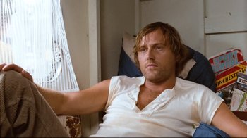 Movie still from “Spetters” (1980), directed by Paul Verhoeven – A person laying on a couch; Medium shot, Low angle