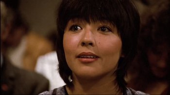 Movie still from “Spetters” (1980), directed by Paul Verhoeven – A person with short black hair; Close Up shot, Low angle
