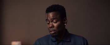 Movie still from “Spiral” (2021), directed by Darren Lynn Bousman – A person with his eyes closed; Close Up shot, Low angle