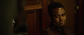 Movie still from “Spiral” (2021), directed by Darren Lynn Bousman – A person wearing a jacket; Close Up shot, Over the shoulder angle