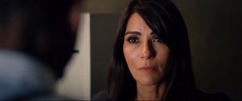 Movie still from “Spiral” (2021), directed by Darren Lynn Bousman – A person looking at a mirror; Close Up shot, Over the shoulder angle