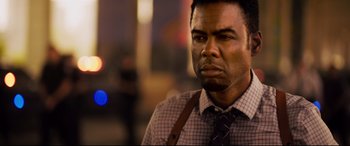 Movie still from “Spiral” (2021), directed by Darren Lynn Bousman – A person wearing a shirt and a tie; Close Up shot, Low angle