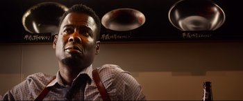 Movie still from “Spiral” (2021), directed by Darren Lynn Bousman – A person wearing a shirt and a tie; Close Up shot, Low angle