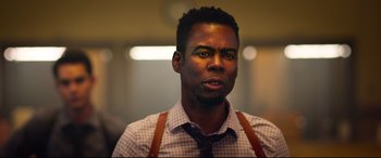 Movie still from “Spiral” (2021), directed by Darren Lynn Bousman – A person wearing a shirt and a tie; Close Up shot, Low angle