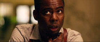 Movie still from “Spiral” (2021), directed by Darren Lynn Bousman – A person with his hand under his chin; Close Up shot, Over the shoulder angle