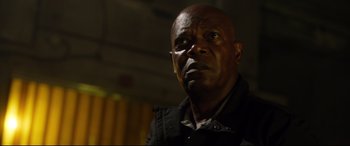 Movie still from “Spiral” (2021), directed by Darren Lynn Bousman – A person wearing a black jacket; Close Up shot, Low angle