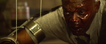 Movie still from “Spiral” (2021), directed by Darren Lynn Bousman – A person holding a cell phone; Close Up shot, Low angle