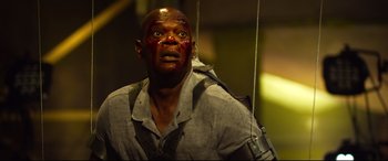 Movie still from “Spiral” (2021), directed by Darren Lynn Bousman – A man with blood all over his face; Close Up shot, Low angle