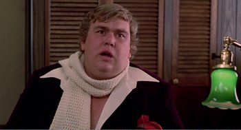 Movie still from “Splash” (1983), directed by Ron Howard – A person wearing a sweater and a scarf; Close Up shot, Low angle