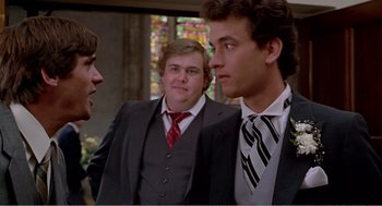 Movie still from “Splash” (1983), directed by Ron Howard – A group of young men standing next to each other in suits; Close Up shot, Over the shoulder angle