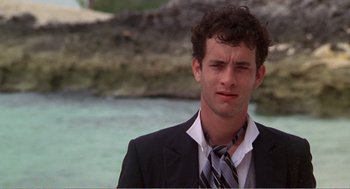 Movie still from “Splash” (1983), directed by Ron Howard – A man in a suit and a tie; Close Up shot, Over the shoulder angle