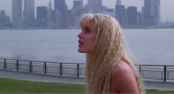 Movie still from “Splash” (1983), directed by Ron Howard – A woman with long blonde hair standing in front of a body of water; Close Up shot, Low angle