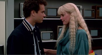 Movie still from “Splash” (1983), directed by Ron Howard – A man and a woman talking to each other; Medium shot, Over the shoulder angle