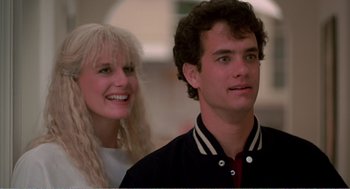 Movie still from “Splash” (1983), directed by Ron Howard – A man and a woman standing next to each other; Close Up shot, Low angle