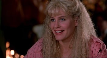 Movie still from “Splash” (1983), directed by Ron Howard – A person with long blonde hair; Close Up shot, Over the shoulder angle