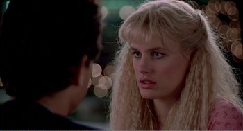 Movie still from “Splash” (1983), directed by Ron Howard – A woman with long blonde hair looking at a man with long blonde hair; Close Up shot, Over the shoulder angle