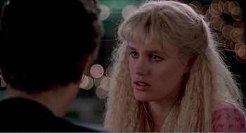 Movie still from “Splash” (1983), directed by Ron Howard – A woman with long blonde hair is talking to a man; Close Up shot, Over the shoulder angle