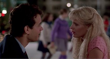 Movie still from “Splash” (1983), directed by Ron Howard – A man and a woman talking to each other; Close Up shot, Over the shoulder angle