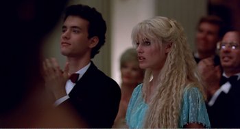 Movie still from “Splash” (1983), directed by Ron Howard – A man and a woman standing next to each other; Close Up shot, Low angle