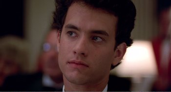 Movie still from “Splash” (1983), directed by Ron Howard – A man that is looking into the distance; Close Up shot, Over the shoulder angle