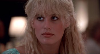 Movie still from “Splash” (1983), directed by Ron Howard – A person with blonde hair; Close Up shot, Over the shoulder angle