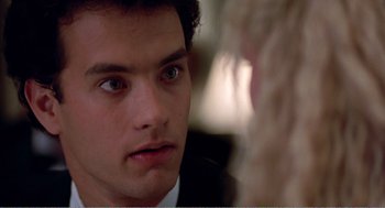 Movie still from “Splash” (1983), directed by Ron Howard – A person looking at a camera; Close Up shot, Over the shoulder angle