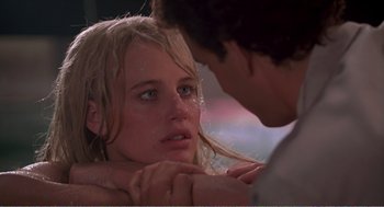 Movie still from “Splash” (1983), directed by Ron Howard – A man and a woman looking into each others eyes; Close Up shot, Over the shoulder angle