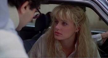 Movie still from “Splash” (1983), directed by Ron Howard – A woman sitting in the back seat of a car talking to a man; Close Up shot, Over the shoulder angle
