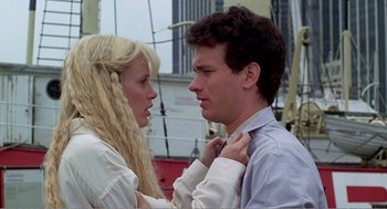 Movie still from “Splash” (1983), directed by Ron Howard – A man and a woman looking at one another; Close Up shot, Low angle