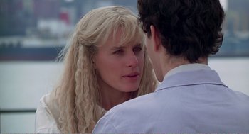 Movie still from “Splash” (1983), directed by Ron Howard – A woman with long blonde hair looking at a young man; Close Up shot, Over the shoulder angle