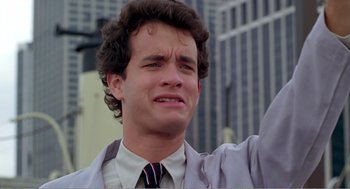 Movie still from “Splash” (1983), directed by Ron Howard – A man that is crying in the street; Close Up shot, Low angle