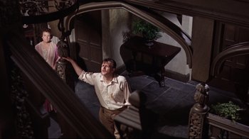 Movie still from “Splendor in the Grass” (1961), directed by Elia Kazan – A man standing in front of an open door; Medium shot, High angle