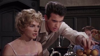 Movie still from “Splendor in the Grass” (1961), directed by Elia Kazan – A man and a woman looking at each other in front of a sink; Close Up shot, Over the shoulder angle