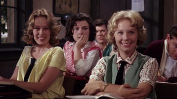 Movie still from “Splendor in the Grass” (1961), directed by Elia Kazan – A group of people sitting in a room; Medium shot, Over the shoulder angle