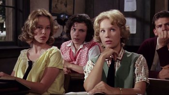 Movie still from “Splendor in the Grass” (1961), directed by Elia Kazan – A group of women sitting next to each other in a room; Medium shot, Low angle